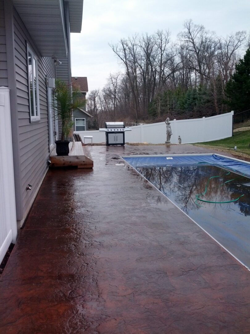 Dark-brown stone flooring for the outdoor pool