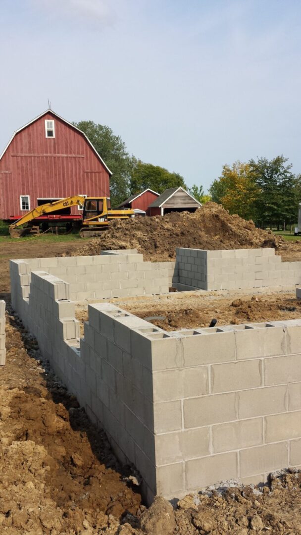 Work in progress of building a foundation with concrete blocks
